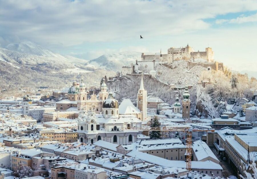 Salzburg: Old Town, Mozart, & Mirabell Gardens Walking Tour - Crossing into Old Town: the Salzach River shift from gardens to Mozart streets