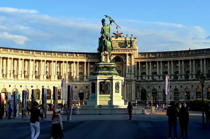 Vienna at First Glance a Private Walking Tour for First Timers - Rathausplatz, Parliament, and Volksgarten: power, symbolism, and a breather
